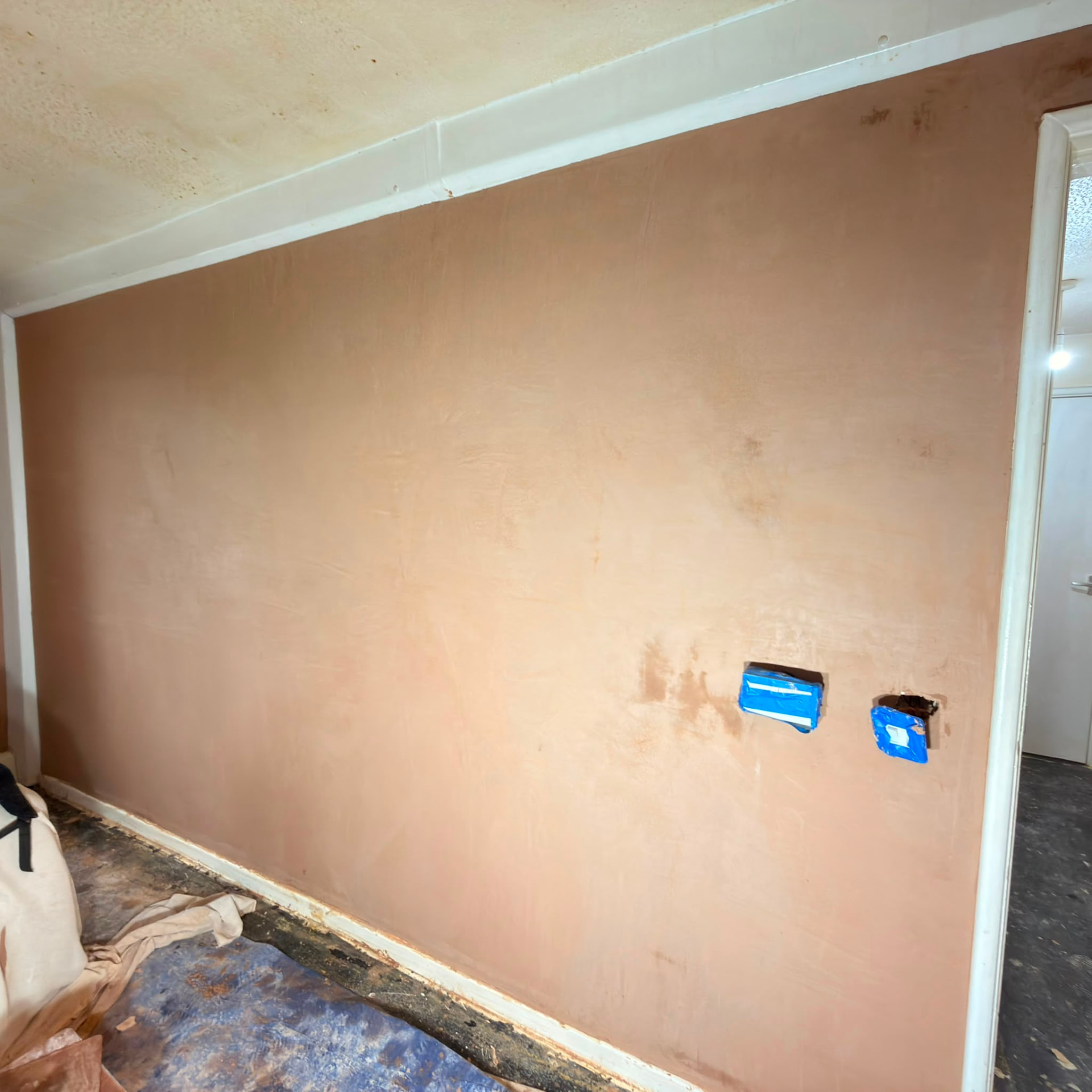 Feature wall skim finish with socket cut-ins