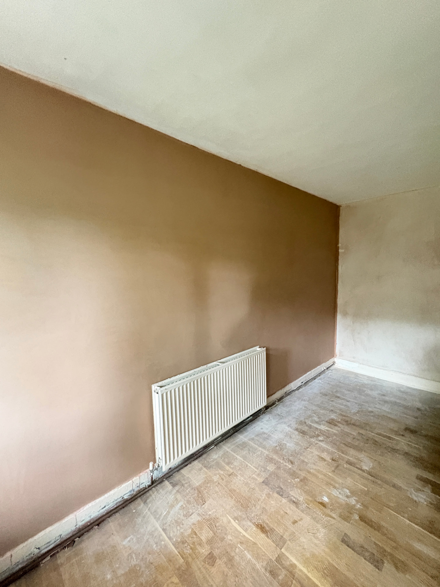 Lounge wall re-skim with radiator detail