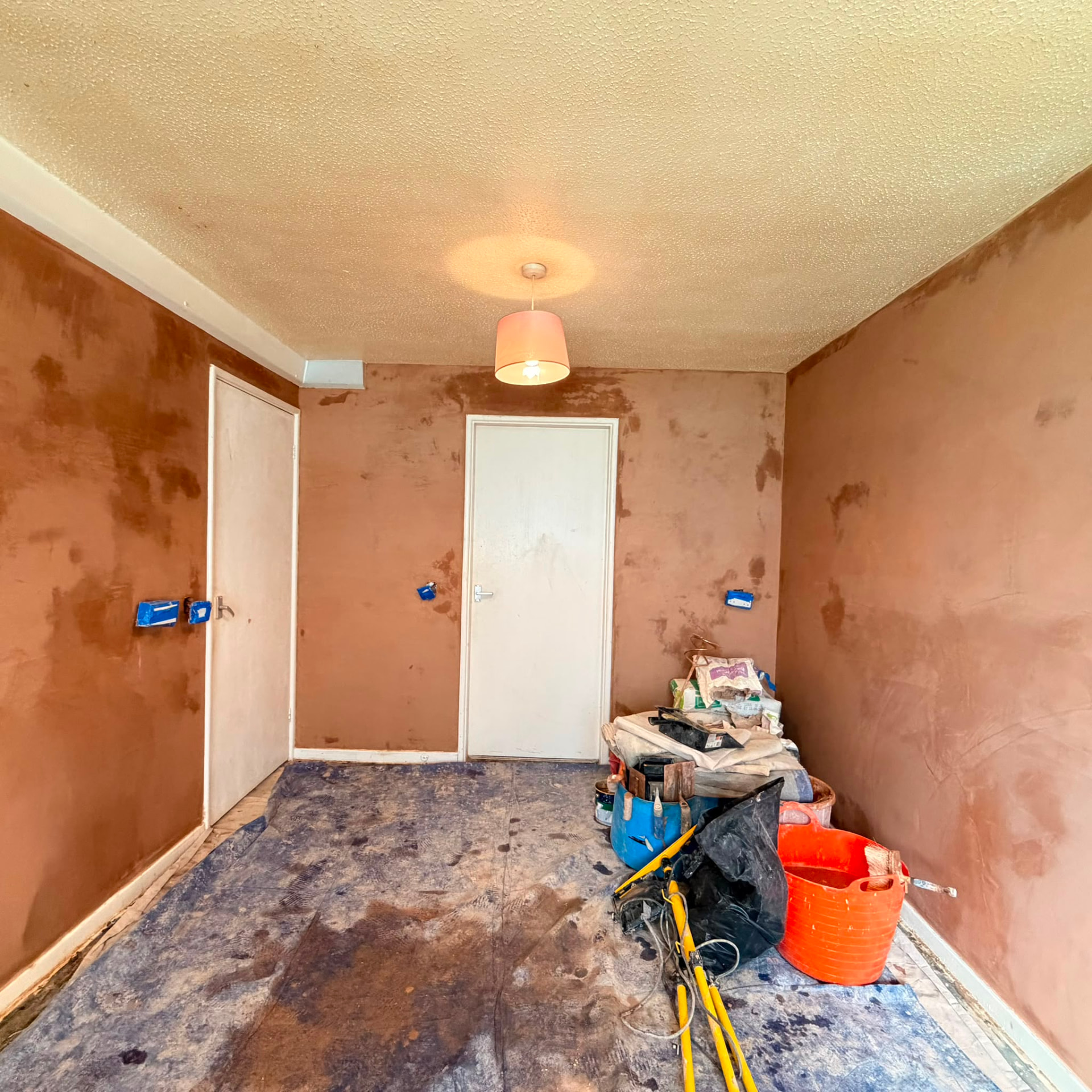 Bedroom walls skimmed around doorways