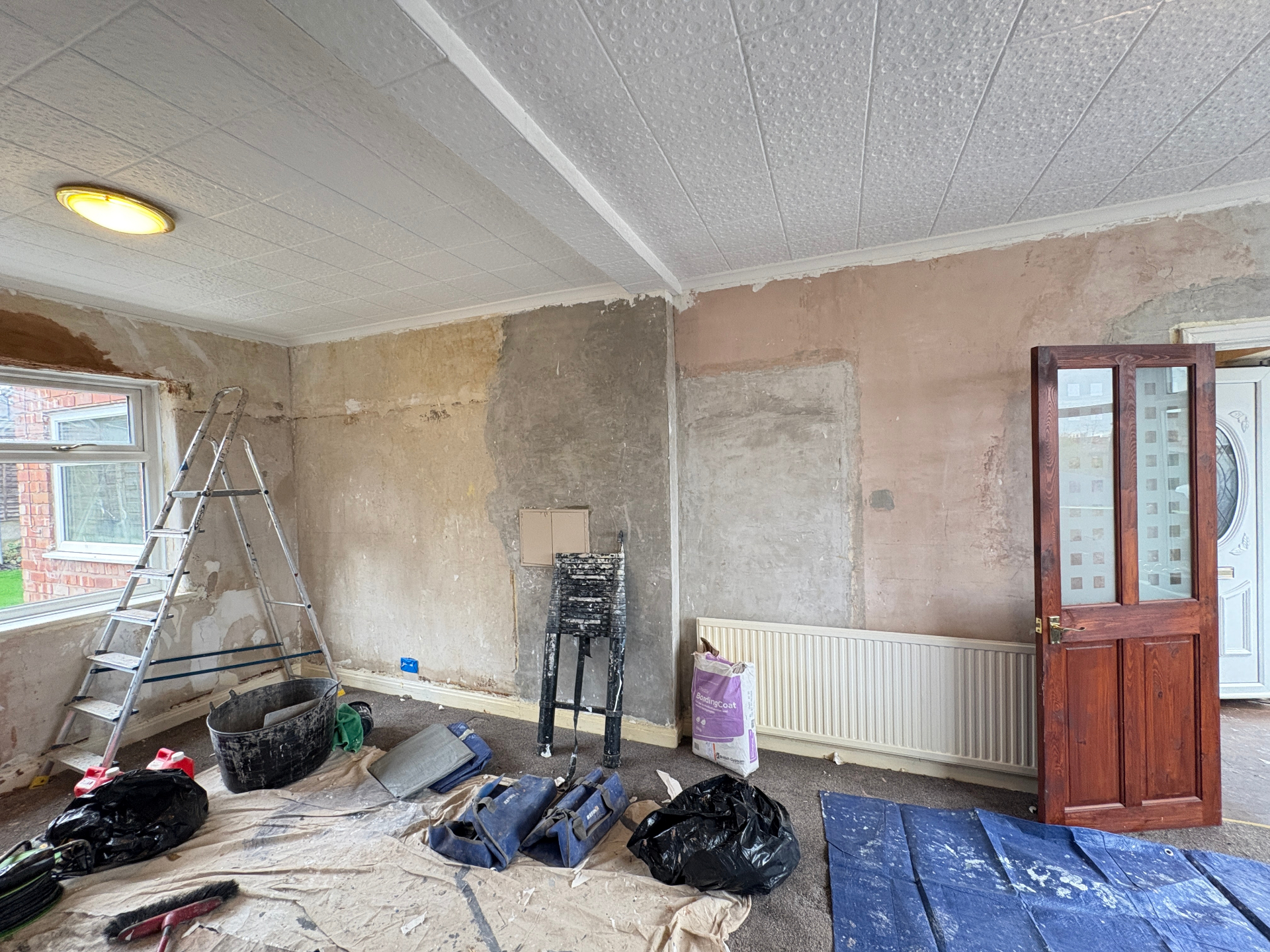 Living room before — secondary angle before re-skim
