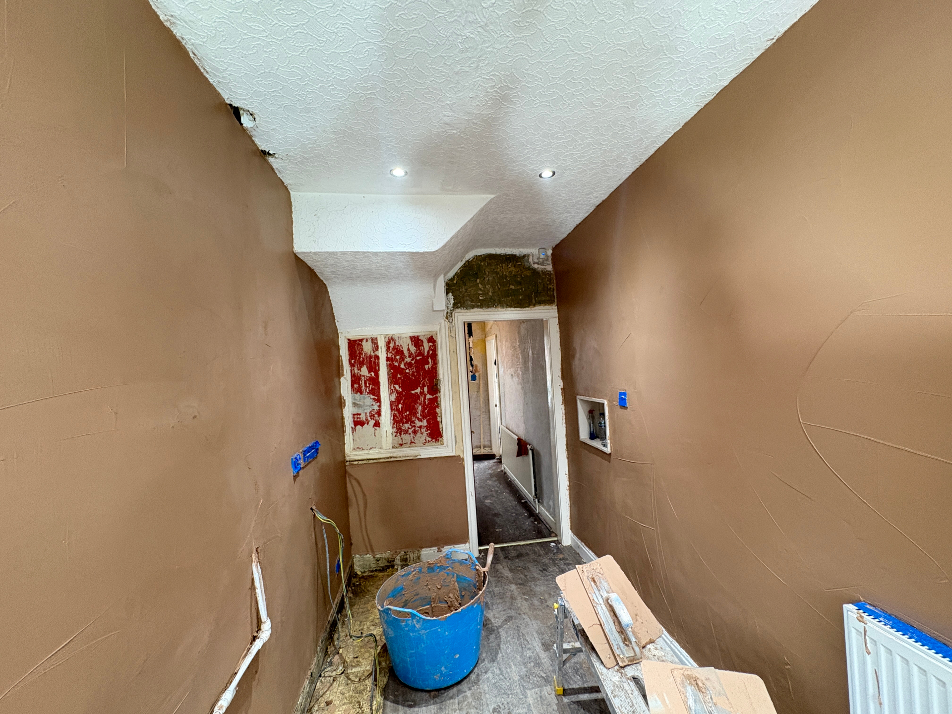 Hallway after — smooth new skim finish